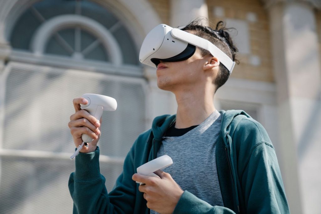 Boy in a VR headset in front of a building